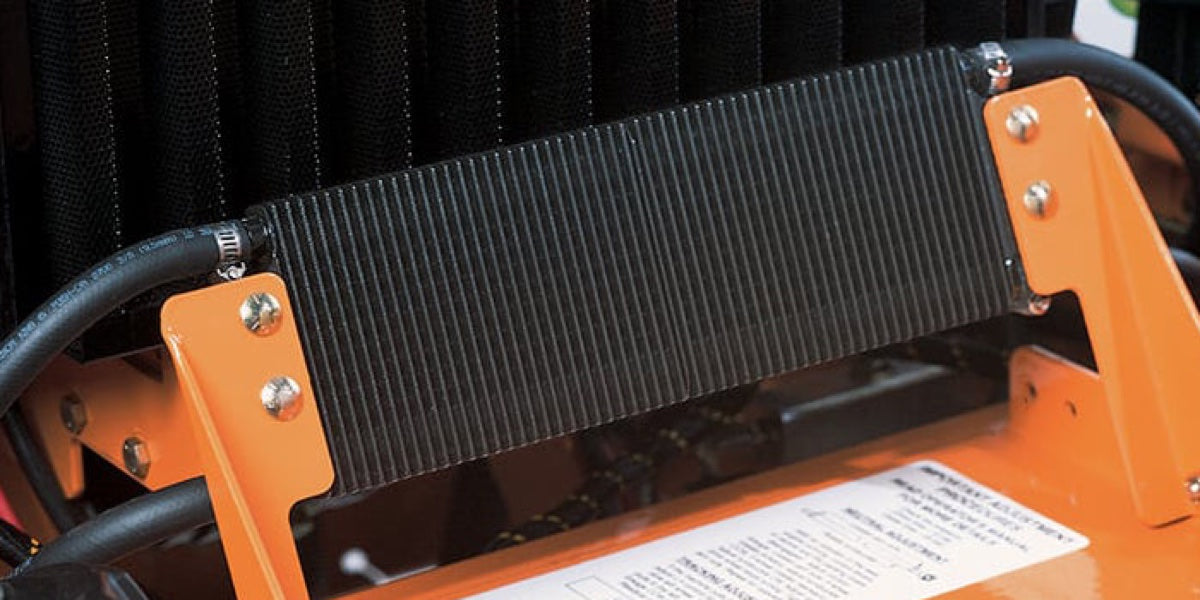 Finned oil cooler mounted in an equipment frame.
